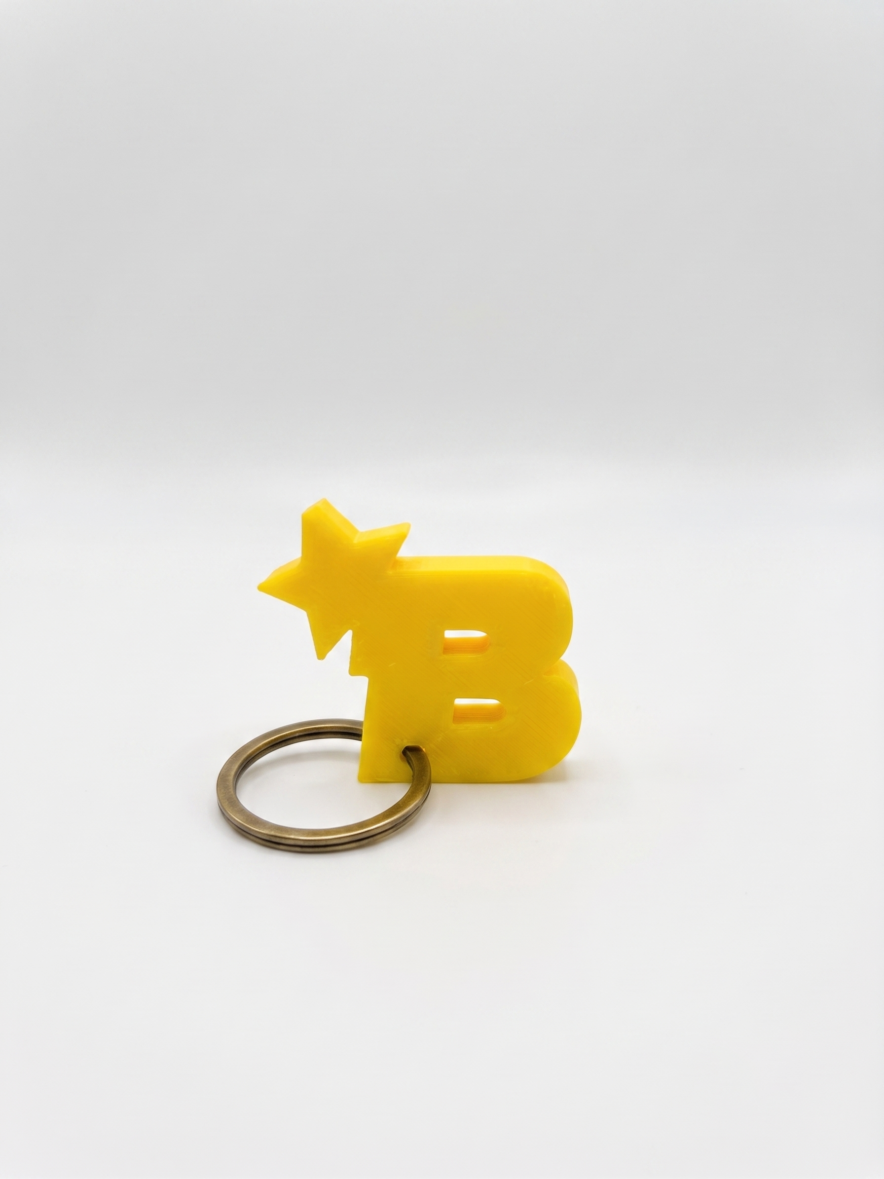 Portachiavi BITSTAR giallo in stampa 3D PLA, portachiavi di design low-poly